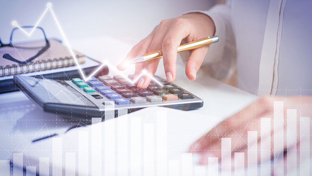 Accountant calculating profit with financial analysis graphs - Güncel Group